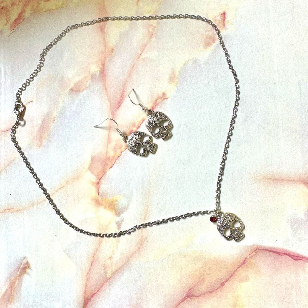 SilverΒ tone skeleton necklaceβand earringsβset